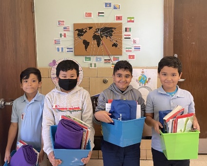 A group of children wearing face masksDescription automatically generated with low confidence